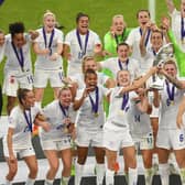 England captain Leah Williamson lifts the trophy with team mates after winning the UEFA Women's Euro 2022 final match between England and Germany (Photo by Michael Regan/Getty Images)