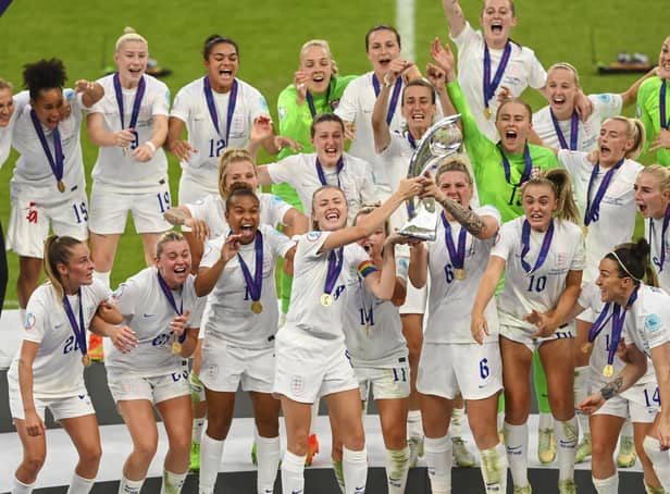 <p>England captain Leah Williamson lifts the trophy with team mates after winning the UEFA Women's Euro 2022 final match between England and Germany (Photo by Michael Regan/Getty Images)</p>