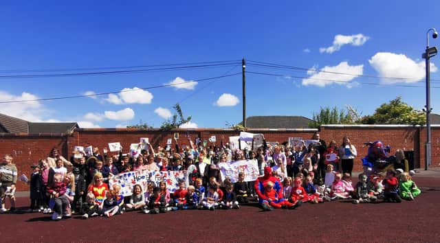 Carmuir Primary School and Nursery turned out to congratulate Harry Frank on his cancer journey with a superheroes day. Pic: Contributed
