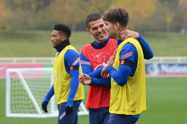 BURTON UPON TRENT, ENGLAND - NOVEMBER 11: Conor Coady and John Stones of England share a joke during a training session at St George's Park on November 11, 2021 in Burton upon Trent, England. (Photo by Michael Regan/Getty Images)