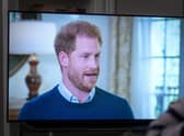 A person at home in Edinburgh watching the Duke of Sussex being interviewed by ITV's Tom Bradby during Harry: The Interview, two days before his controversial autobiography Spare is published