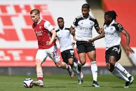 Arsenal's English midfielder Emile Smith Rowe (L) dribbles away from Fulham's Gabonese midfielder Mario Lemina (C) and Fulham's Cameroonian midfielder Andre-Frank Zambo Anguissa (R) 

(Photo by FACUNDO ARRIZABALAGA/POOL/AFP via Getty Images)