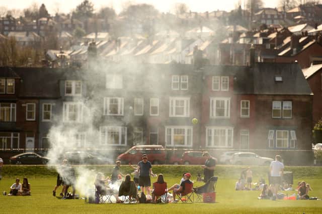 People enjoy the sunshine in Endcliffe Park in Sheffield as lockdown rules allow 30 people to meet outside (Getty).