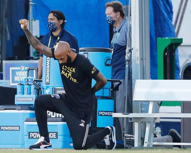 Thierry Henry takes a knee in support of the Black Lives Matter movement prior to a game for Montreal Impact. Henry has since announced he has deactivated his social media accounts.