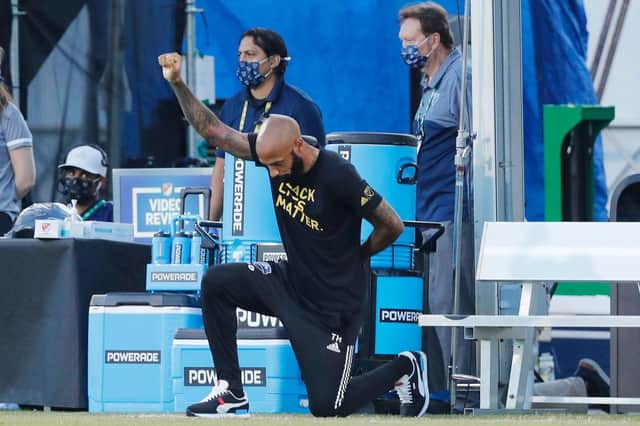 Thierry Henry takes a knee in support of the Black Lives Matter movement prior to a game for Montreal Impact. Henry has since announced he has deactivated his social media accounts.