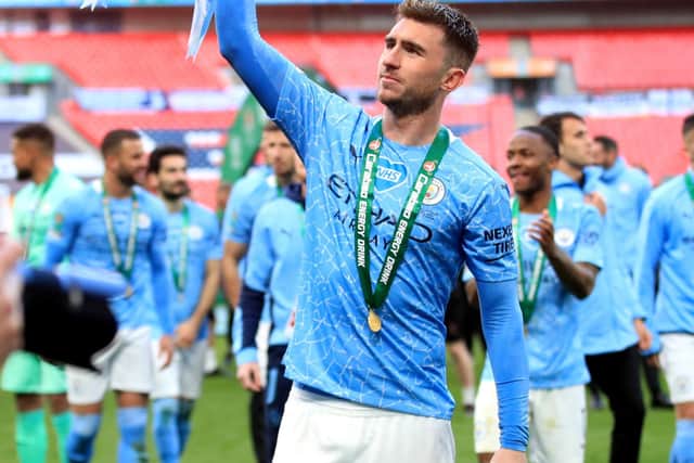 Manchester City's Aymeric Laporte celebrates with the trophy after winning the Carabao Cup Final at Wembley Stadium, London. (Photo: Adam Davy/PA Wire)
