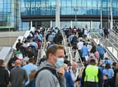 Spectators arrive at Wembley Stadium in north London on August 7, 2021 to watch the English FA Community Shield football match between Manchester City and Leicester City.