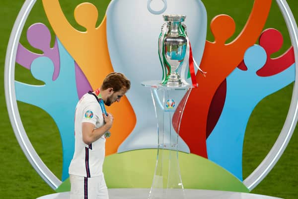 Harry Kane walks past the Euros trophy seconds after receiving his runners up medal from the Euro 2020 final. (Pic: Getty)