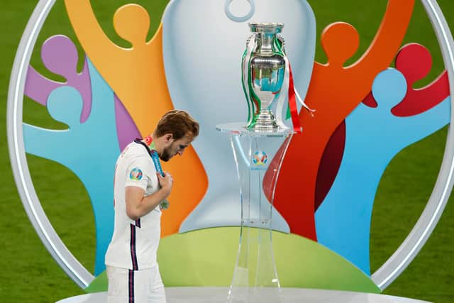 Harry Kane walks past the Euros trophy seconds after receiving his runners up medal from the Euro 2020 final. (Pic: Getty)