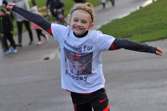 Jordan Banks, 9, died after being struck by lightning on May 11. Here he is pictured running a marathon in Stanley Park to raise money for a mental health charity.