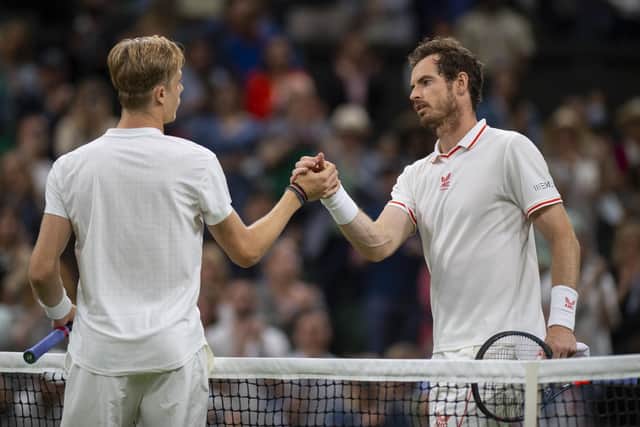 Denis Shapovalov shakes hands with Andy Murray after he wins at the end of the game, in the third round of the Gentlemen's Singles on Centre Court on day five of Wimbledon (PA)