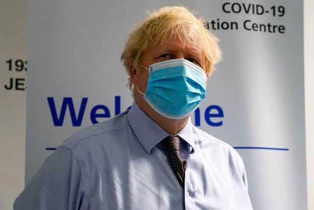 Boris Johnson's government is allegedly looking to ease the isolation period for fully vaccinated Brits, from as early as next month (Picture: Getty Images)