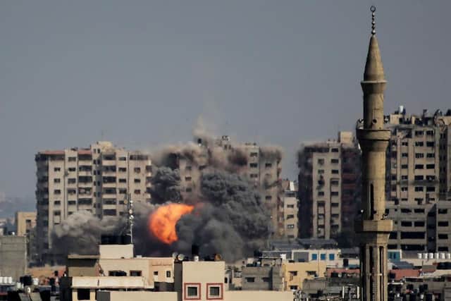 An explosion on a residential tower caused by Israeli raids in the northern Gaza Strip on October 12, 2023 in Gaza City, Gaza. At least 1,200 people, including at least 326 children, have been killed and more than 300,000 displaced, after Israel launched sustained retaliatory air strikes after a large-scale attack by Hamas.