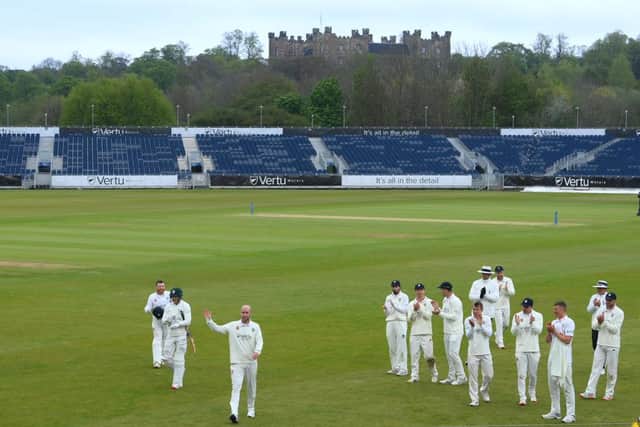 Chris Rushworth is applauded by team mates as the teams leave the field at tea after taking the wicket of Worcestershire batsman Jack Haynes for his 528th First class wicket for Durham.