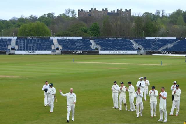 Chris Rushworth is applauded by team mates as the teams leave the field at tea after taking the wicket of Worcestershire batsman Jack Haynes for his 528th First class wicket for Durham.