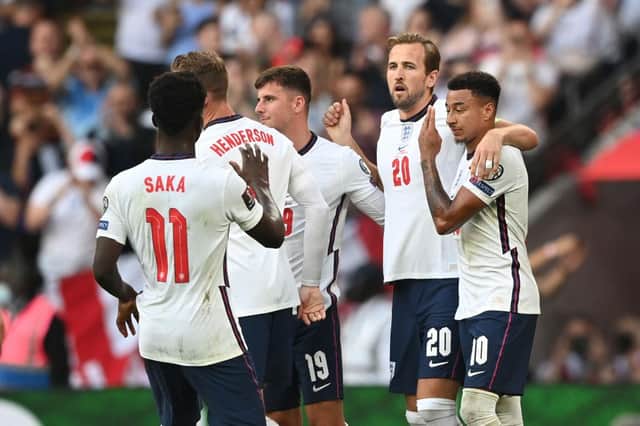 Harry Kane of England celebrates with Jesse Lingard after scoring their team's second goal from the penalty spot during the 2022 FIFA World Cup Qualifier match between England and Andorra at Wembley Stadium on September 05, 2021 in London, England. (Photo by Shaun Botterill/Getty Images)