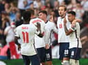 Harry Kane of England celebrates with Jesse Lingard after scoring their team's second goal from the penalty spot during the 2022 FIFA World Cup Qualifier match between England and Andorra at Wembley Stadium on September 05, 2021 in London, England. (Photo by Shaun Botterill/Getty Images)