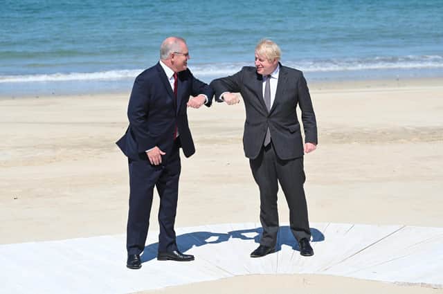 Prime Minister Boris Johnson greets Australia's Prime Minister Scott Morrison at an official welcome at the G7 summit in Carbis Bay (Photo by Leon Neal/Getty Images)