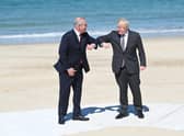 Prime Minister Boris Johnson greets Australia's Prime Minister Scott Morrison at an official welcome at the G7 summit in Carbis Bay (Photo by Leon Neal/Getty Images)