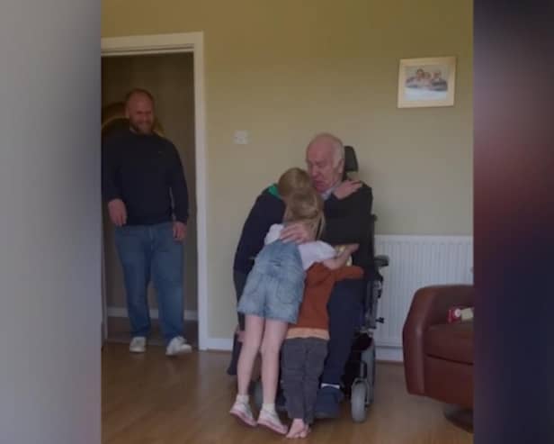George was reunited with his grandkids after seven months apart (Picture: SWNS)