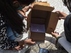 A pinhole camera is a safe and easy way to view an eclipse (Photo: SAM PANTHAKY/AFP via Getty Images)