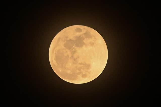 The moon is believed to have been created after a massive collision between the Earth and a Mars-sized object (Picture: Roslan Rahman/AFP via Getty Images)