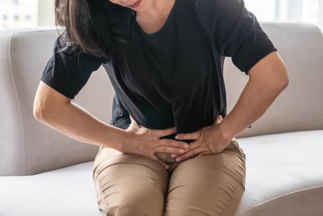 Bowel cancer symptoms can include persistent lower abdominal (tummy) pain, bloating or discomfort (Photo: Shutterstock)