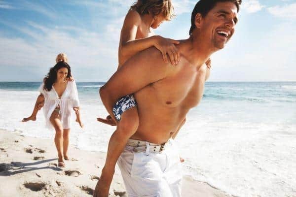 Family enjoying sandy beach