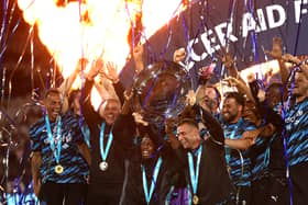 Bolt lifting the trophy along with Ukrainian icon, Andriy Shevchenko (Photo by Alex Pantling/Getty Images)