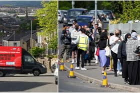 A electronic Covid-19 warning billboard drives around the streets in Blackburn, while people queue for vaccinations at the ESSA academy in Bolton (Getty Images)