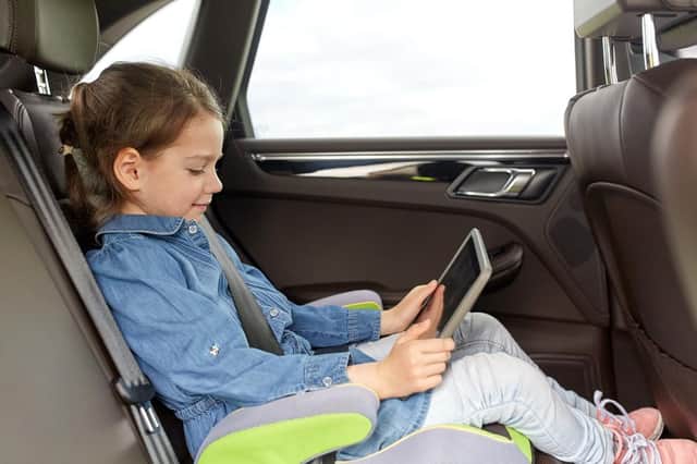 A little screen time watching films or playing games can help entertain young passengers