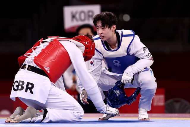 Lee Da-bin (R) of Team South Korea shakes hands after defeating Bianca Walkden during the Women's +67kg Taekwondo semi-final.