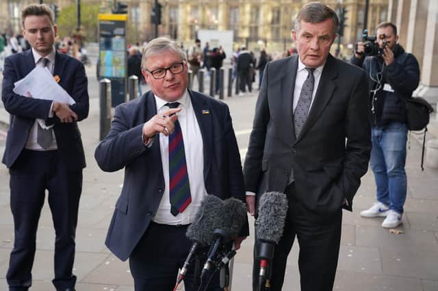 European Research Group (ERG) chair Mark Francois (left), and deputy chair David Jones, speak to the media outside Portcullis House, Westminster, following the release of the 'Star Chamber' of lawyers for the ERG's assessment of Rwanda legislation.
