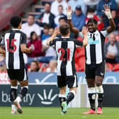 Ryan Fraser of Newcastle United celebrates with team mate Allan Saint-Maximin after scoring his team's first goal during the Pre-Season Friendly match between Doncaster Rovers and Newcastle United at at Keepmoat Stadium on July 23, 2021 in Doncaster, England.