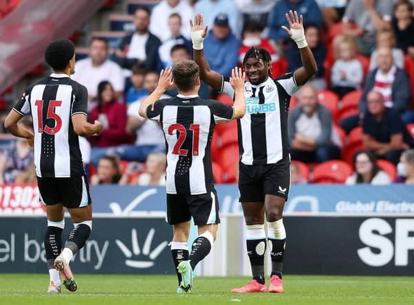 Ryan Fraser of Newcastle United celebrates with team mate Allan Saint-Maximin after scoring his team's first goal during the Pre-Season Friendly match between Doncaster Rovers and Newcastle United at at Keepmoat Stadium on July 23, 2021 in Doncaster, England.