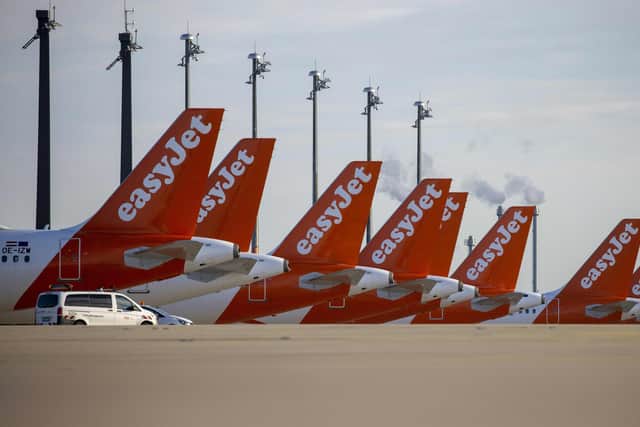 Easyjet planes are seen parked at the "Berlin Brandenburg Airport Willy Brandt" in Schoenefeld, southeast of Berlin (Photo by ODD ANDERSEN/AFP via Getty Images)