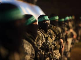 Members of the Izz ad-Din al-Qassam Brigades, the armed wing of the Hamas movement (Photo: MAHMUD HAMS/AFP via Getty Images)