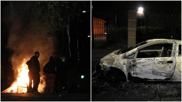 A burnt out car in the Tigers Bay Area of North Belfast during further unrest in Northern Ireland (PA Media)