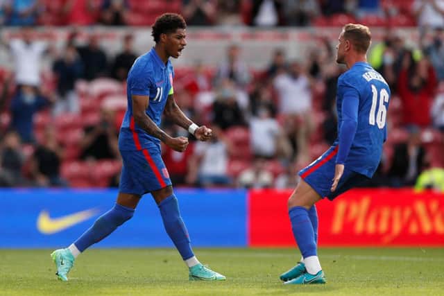 Marcus Rashford of England celebrates after scoring from the penalty spot.