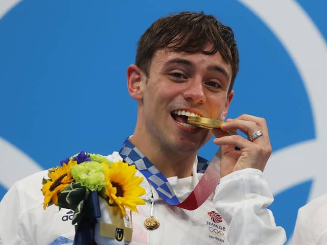 TOKYO, JAPAN - JULY 26: Tom Daley of Team Great Britain poses with the gold medal during the medal presentation for the Men's Synchronised 10m Platform Final on day three of the Tokyo 2020 Olympic Games at Tokyo Aquatics Centre on July 26, 2021 in Tokyo, Japan. (Photo by Clive Rose/Getty Images)
