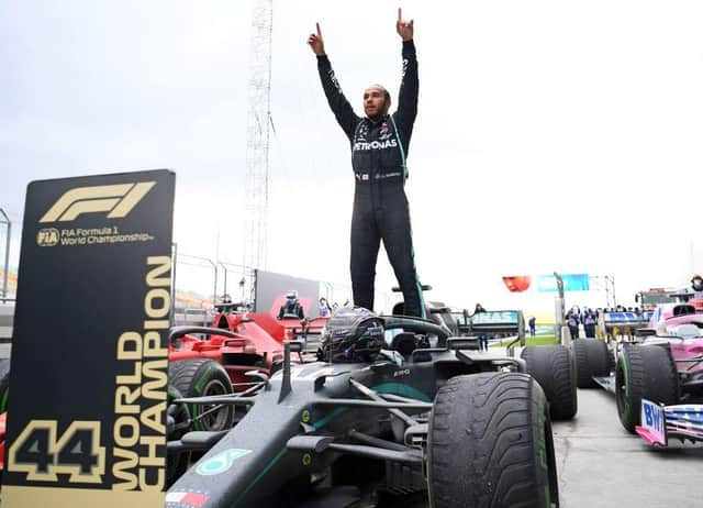 Mercedes' British driver Lewis Hamilton celebrates after winning the 2020 Turkish Formula One Grand Prix.
