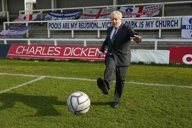 Prime Minister Boris Johnson practices his football skills as he visits Hartlepool United Football Club on April 23, 2021 (Photo by Ian Forsyth/Getty Images)