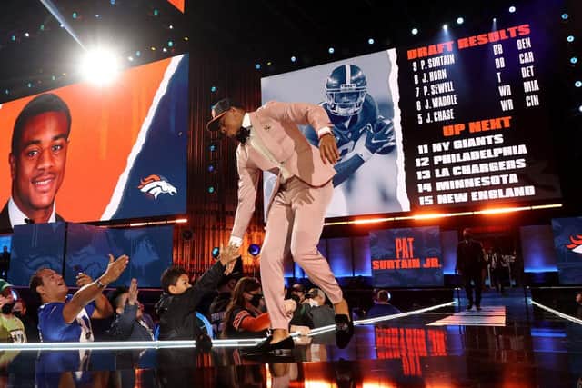 Patrick Surtain II walks onstage after being selected ninth by the Denver Broncos during round one of the 2021 NFL Draft.