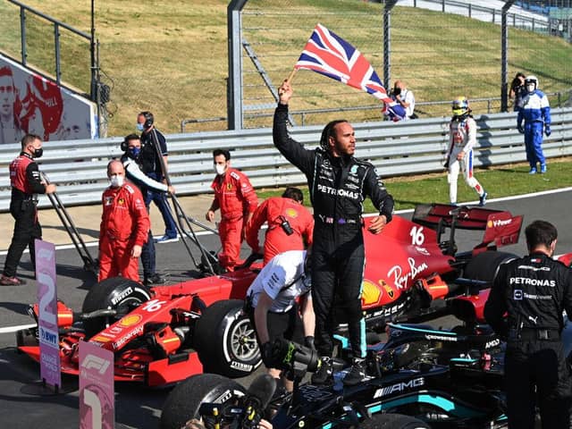 Race winner Lewis Hamilton of Great Britain and Mercedes GP celebrates in parc ferme during the F1 Grand Prix of Great Britain at Silverstone on July 18, 2021 in Northampton, England. (Photo by Michael Regan/Getty Images)