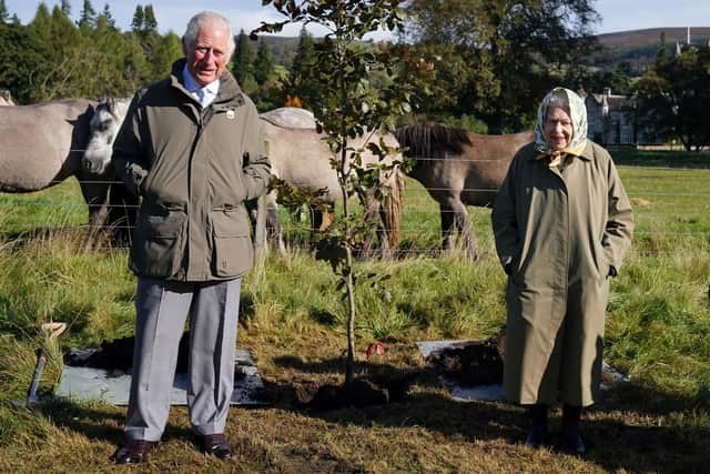 King Charles pictured with his mother Queen Elizabeth II at Balmoral in October 2021 with the Highland Pony herd in the background. PIC: Andrew Milligan/Pool/via Getty.