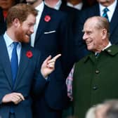 Prince Harry and Prince Phillip enjoy the atmosphere during the 2015 Rugby World Cup Final match between New Zealand and Australia at Twickenham Stadium (Photo by Phil Walter/Getty Images)