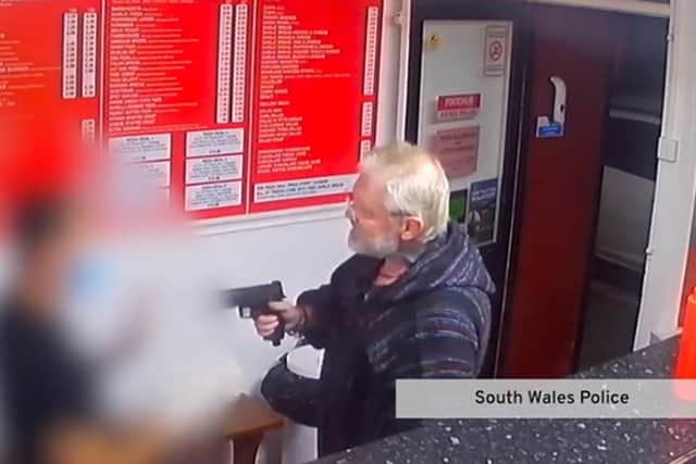 Footage of the man pulling the imitation firearm in the kebab shop (Photo: police handout)