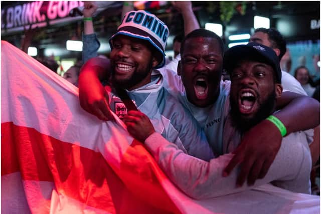 England fans cheer at BOXPARK Croydon as they watch a live broadcast of the semi-final match between England and Denmark  (Getty Images)
