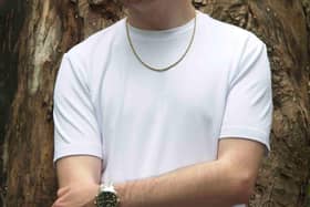 Billy Holley pictured in a moment of calm, showing the more hopeful side behind the story of “Rising”.