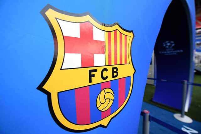 The FC Barcelona badge displays the Saint George's Cross as he is also the patron saint of Catalonia - known as Sant Jordi. (Franck Fife/AFP via Getty Images)
